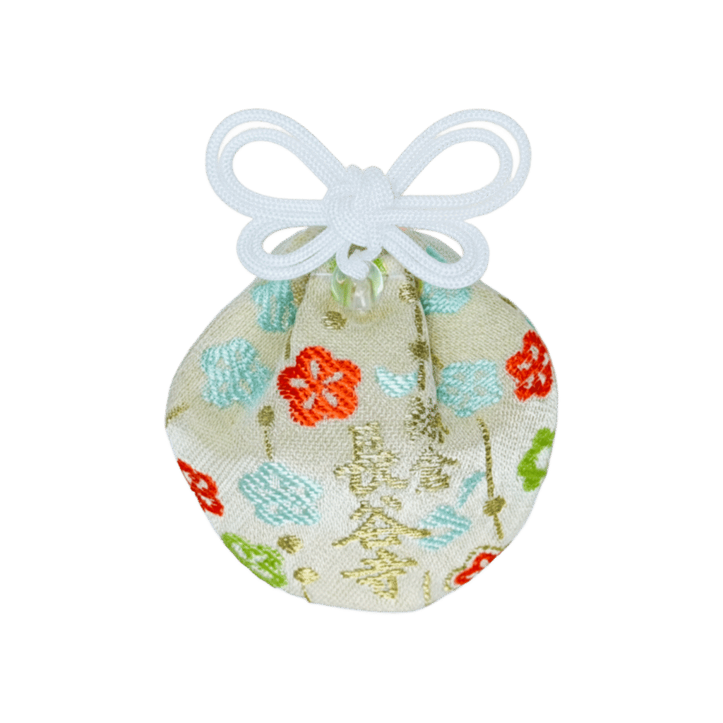 Small round cream Omamori pouch with colorful floral embroidery, tied with an intricate white butterfly bow knot.